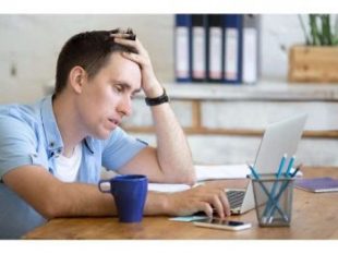 Tired person working at computer